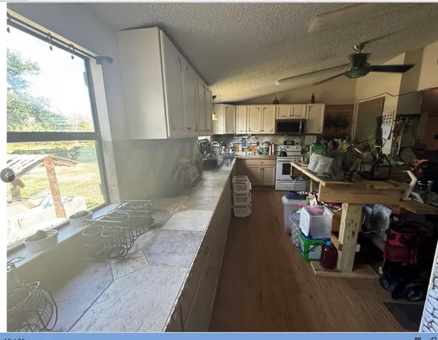 a view of a living room and a kitchen