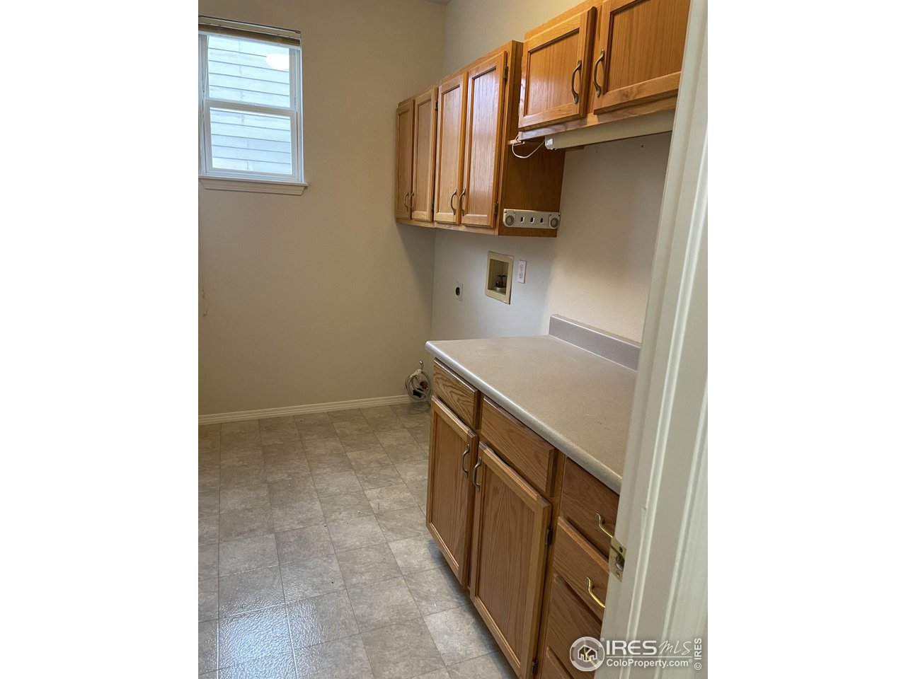 613 Rider Ridge Drive Longmont, CO 80504 - Photo 12 of 34 Laundry room with plenty of cabinets