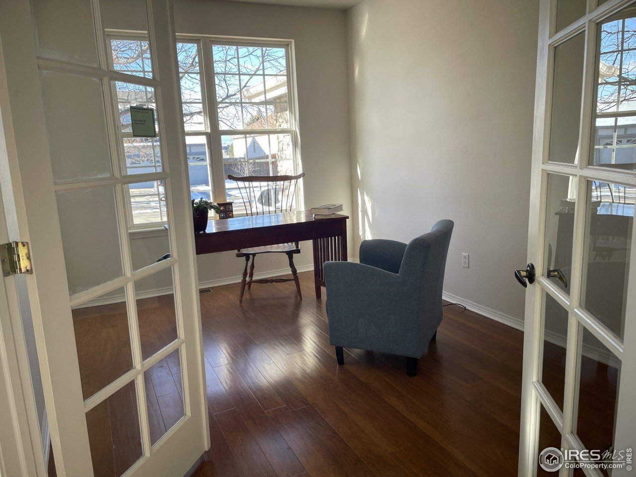 613 Rider Ridge Drive Longmont, CO 80504 - Photo 3 of 34 Sun lit home office with double doors for privacy