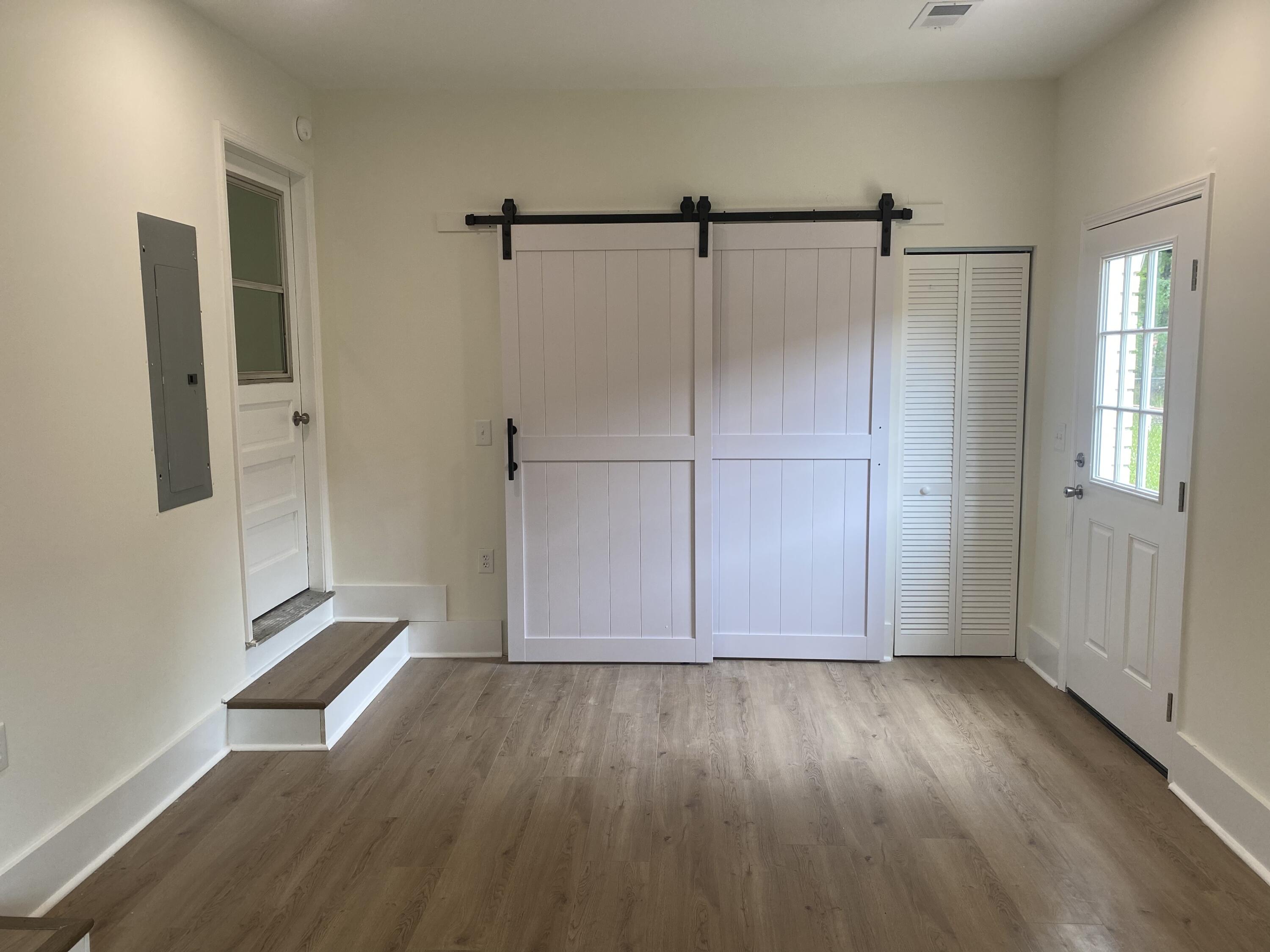 404 Farm Road Goose Creek, SC 29445 - Photo 14 of 41 New Barn Door in Step Down Family Room