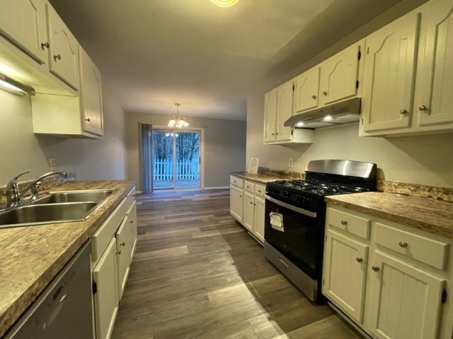 10 Ingleshire Road Montgomery, IL 60538 - Photo 12 of 26 a kitchen with stainless steel appliances granite countertop a stove a sink and a granite counter tops