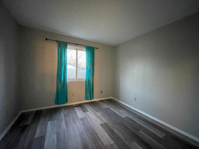 10 Ingleshire Road Montgomery, IL 60538 - Photo 16 of 26 a view of an empty room with wooden floor and a window