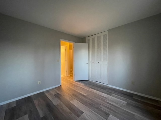 10 Ingleshire Road Montgomery, IL 60538 - Photo 17 of 26 a view of an empty room with wooden floor and a window