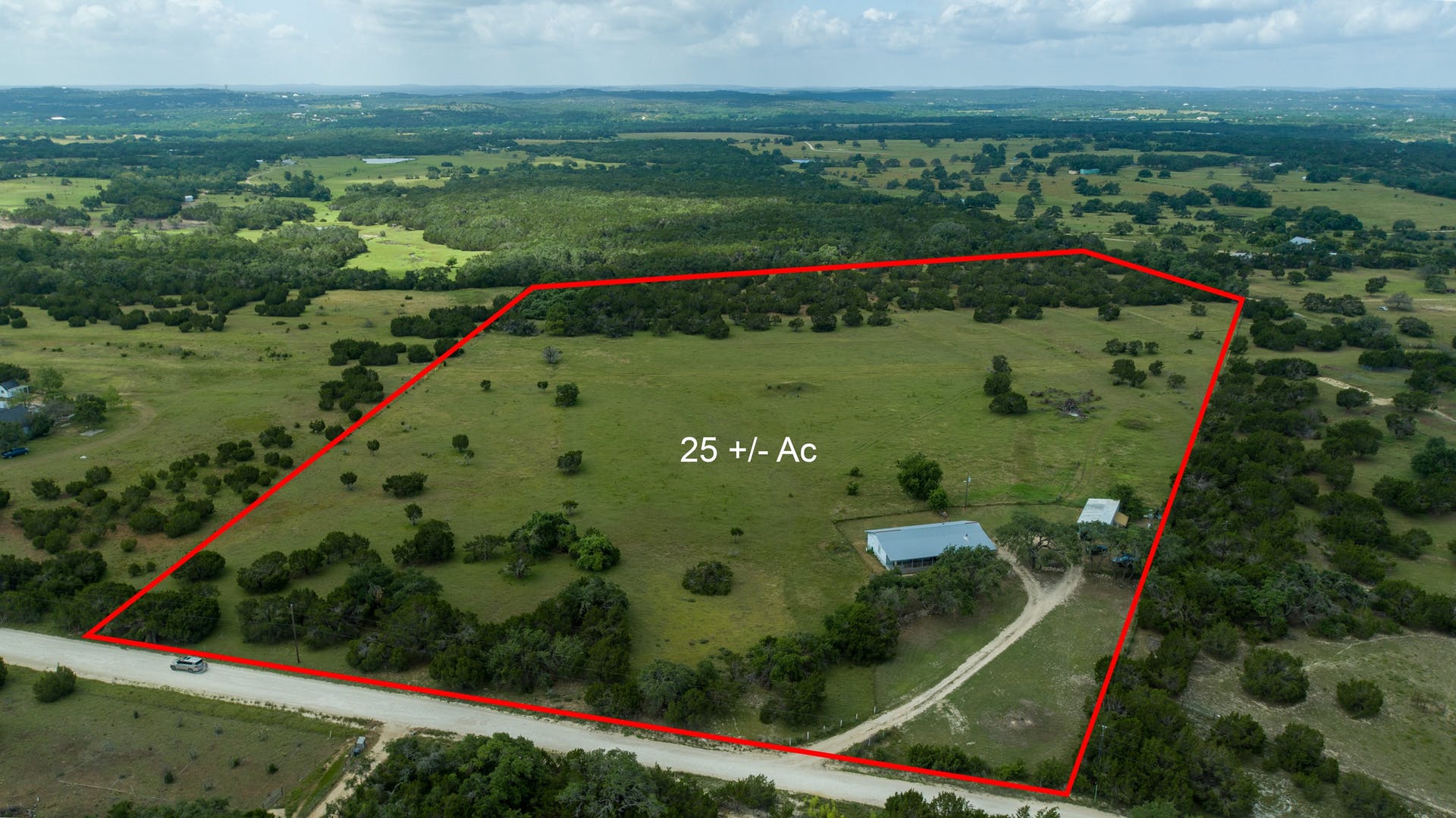 501 Myers Creek Road Dripping Springs, TX 78620 - Photo 1 of 33 Rolling green pastures and mature trees define this expansive country property with distant horizon views.