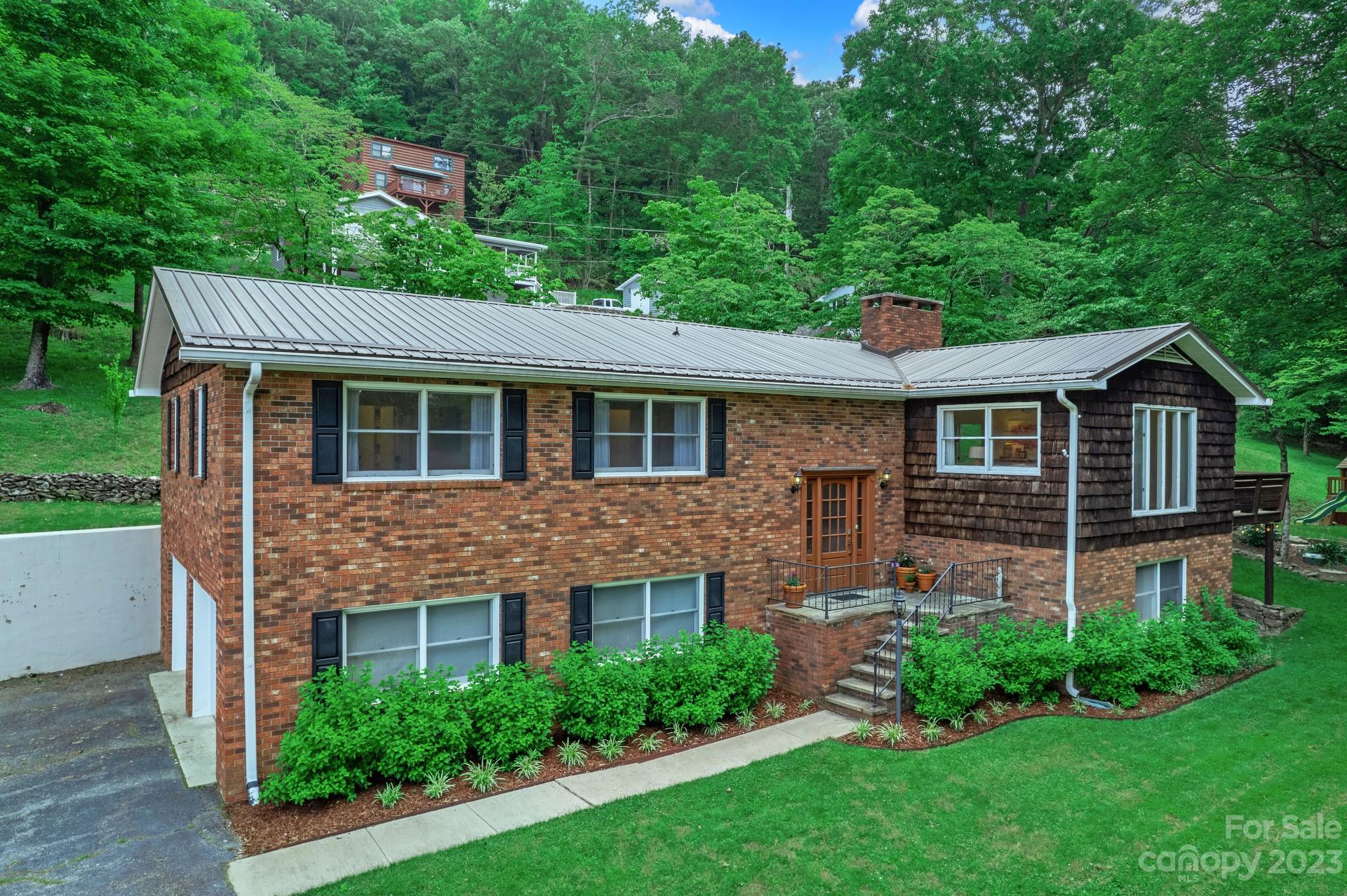 298 Camp Rock Road, Unit 14 Boone, NC 28607 - Photo 1 of 45 a front view of a house with a yard