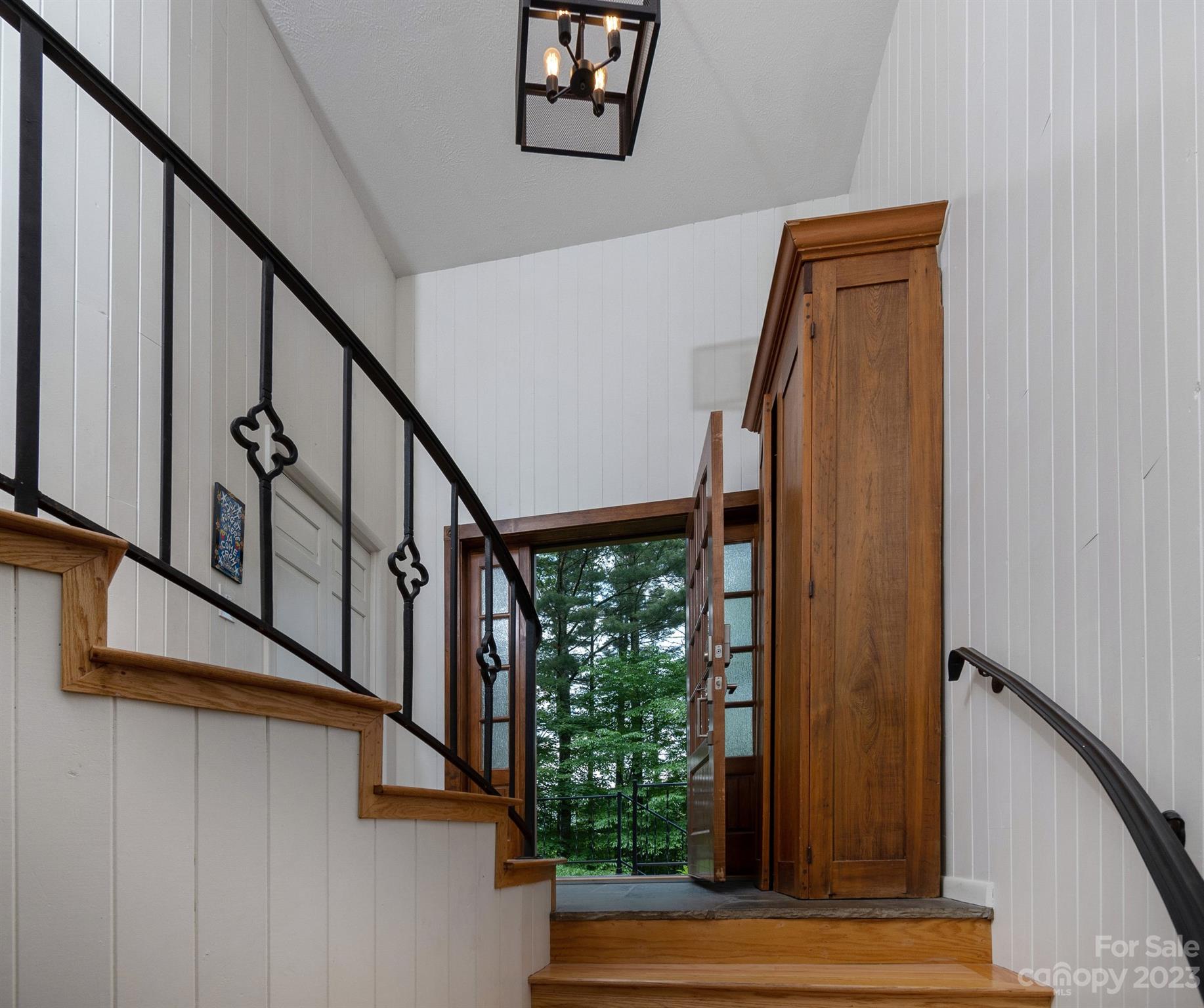 298 Camp Rock Road, Unit 14 Boone, NC 28607 - Photo 12 of 45 a view of staircase with lots of green walls