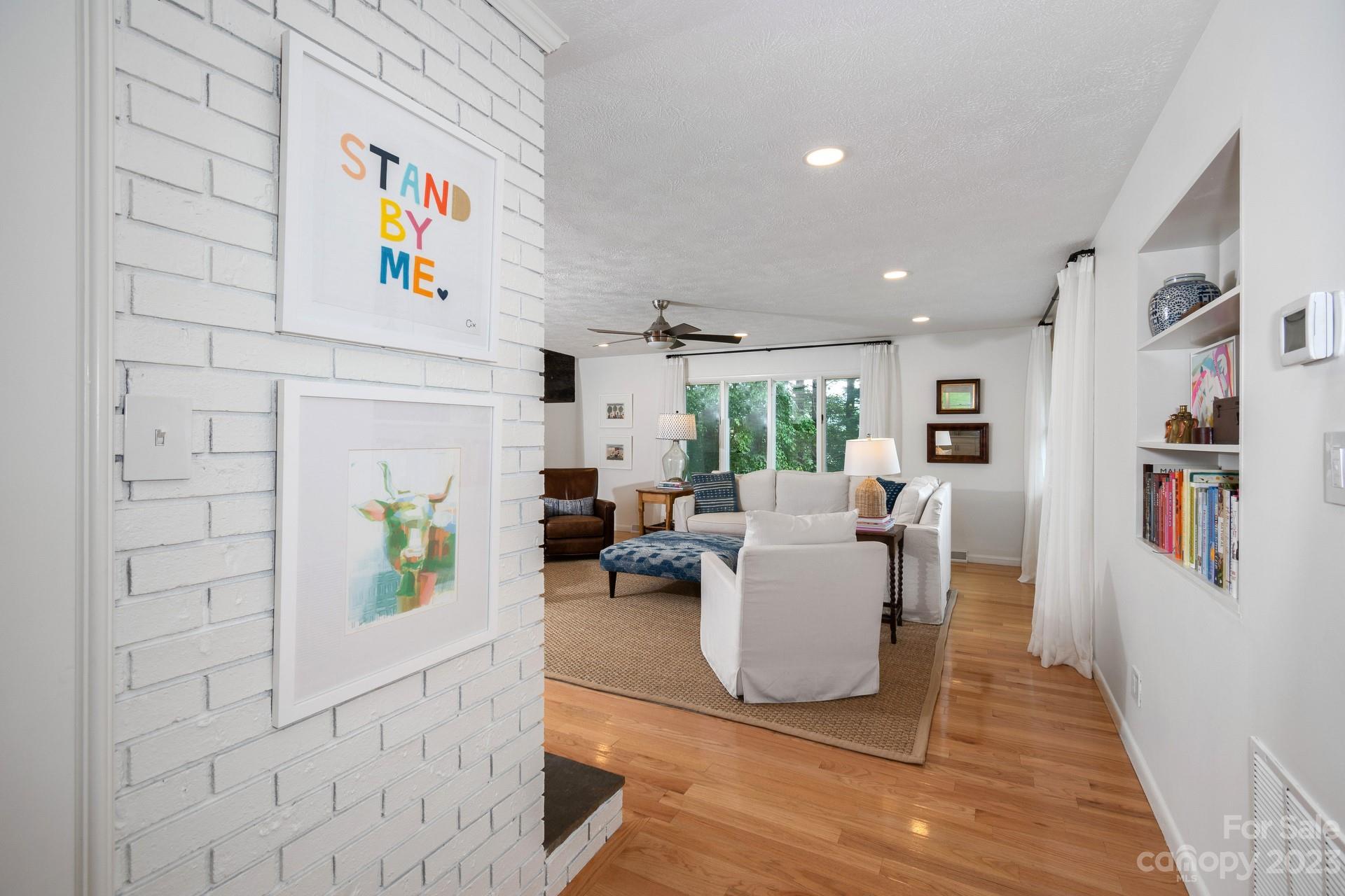 298 Camp Rock Road, Unit 14 Boone, NC 28607 - Photo 13 of 45 a living room with fireplace furniture and a table