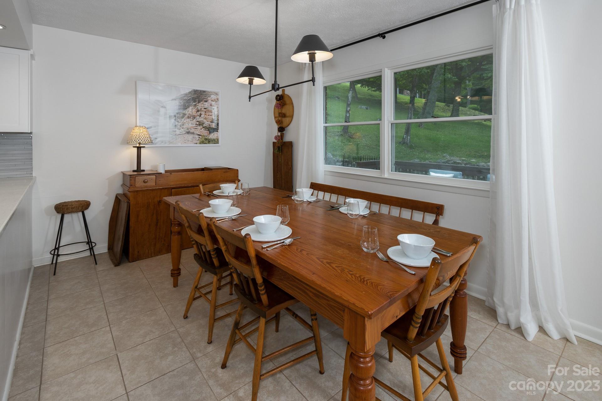 298 Camp Rock Road, Unit 14 Boone, NC 28607 - Photo 19 of 45 a view of a dining room with furniture window and outside view