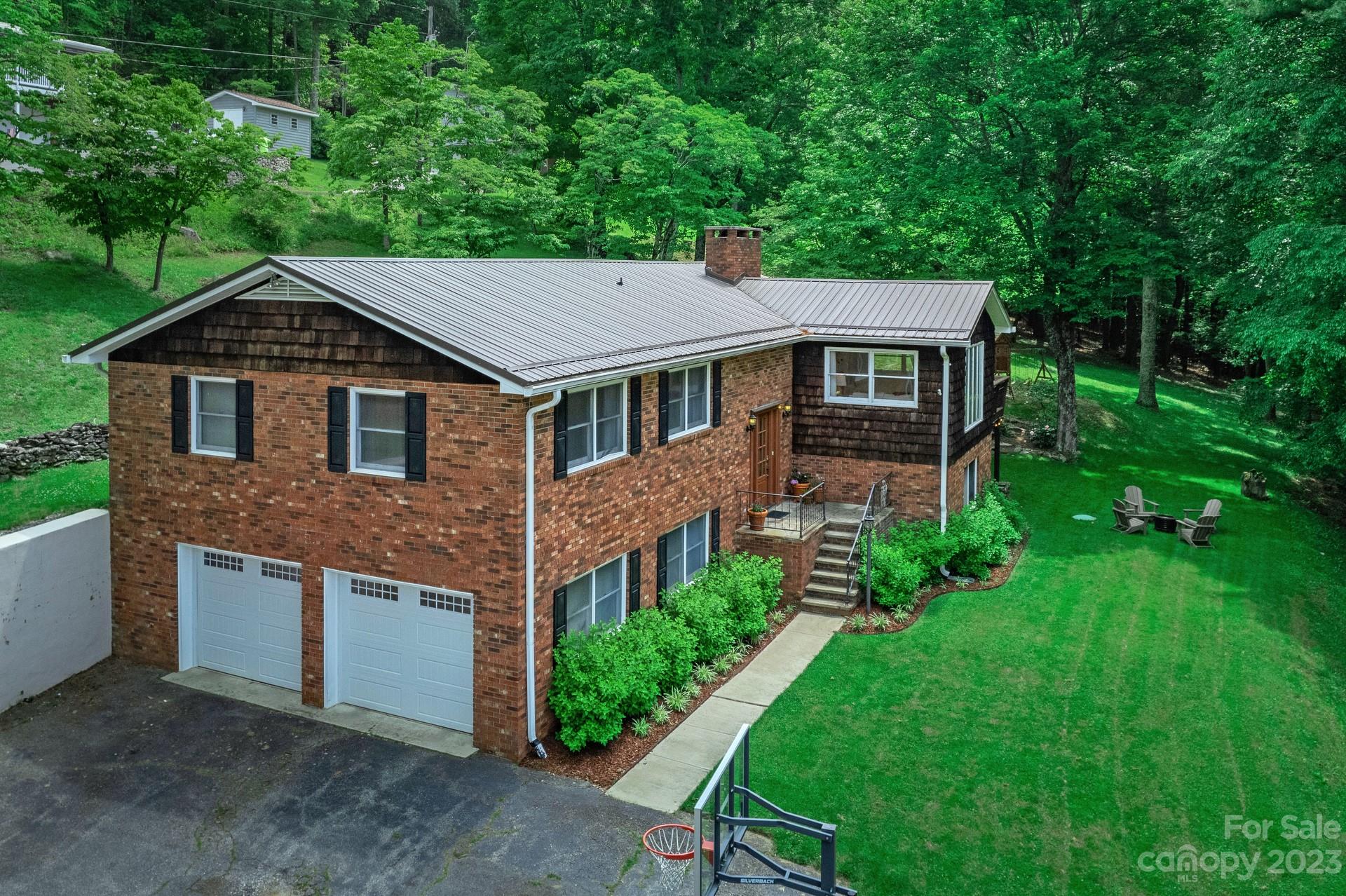 298 Camp Rock Road, Unit 14 Boone, NC 28607 - Photo 2 of 45 a front view of a house with a yard