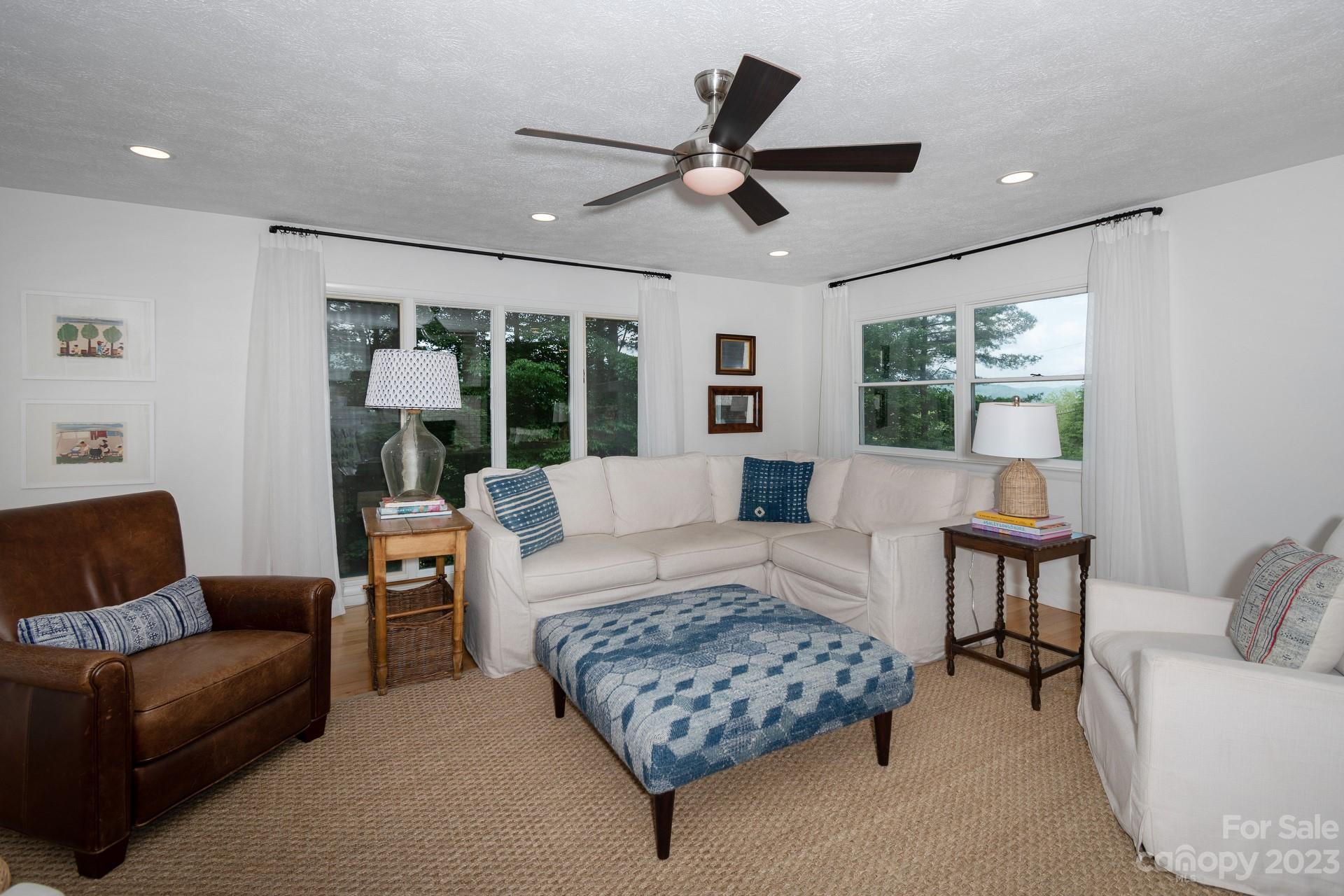 298 Camp Rock Road, Unit 14 Boone, NC 28607 - Photo 21 of 45 a living room with furniture and a large window