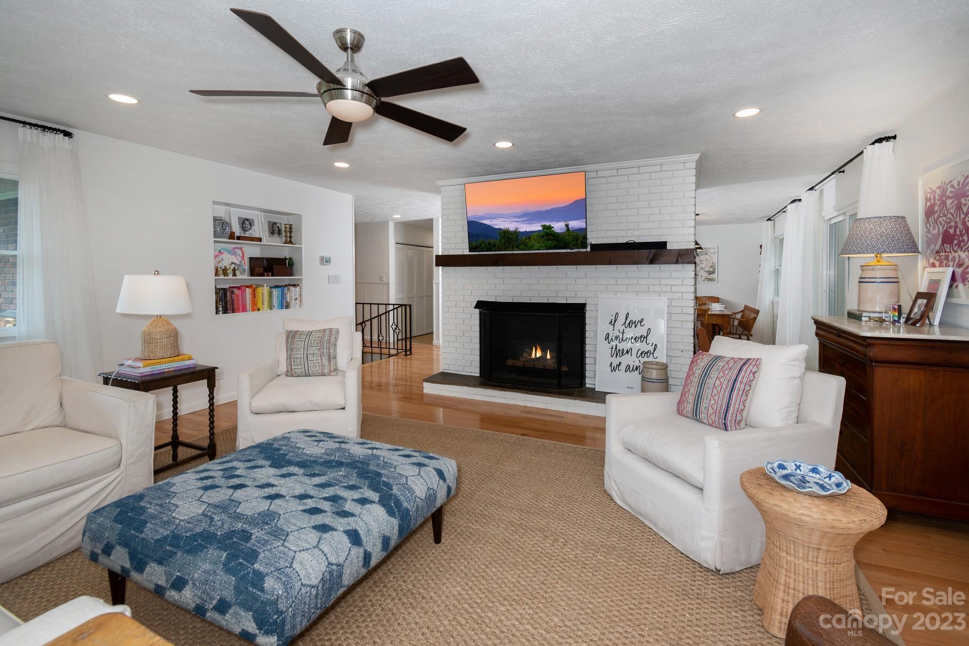 298 Camp Rock Road, Unit 14 Boone, NC 28607 - Photo 23 of 45 a living room with furniture and a fireplace