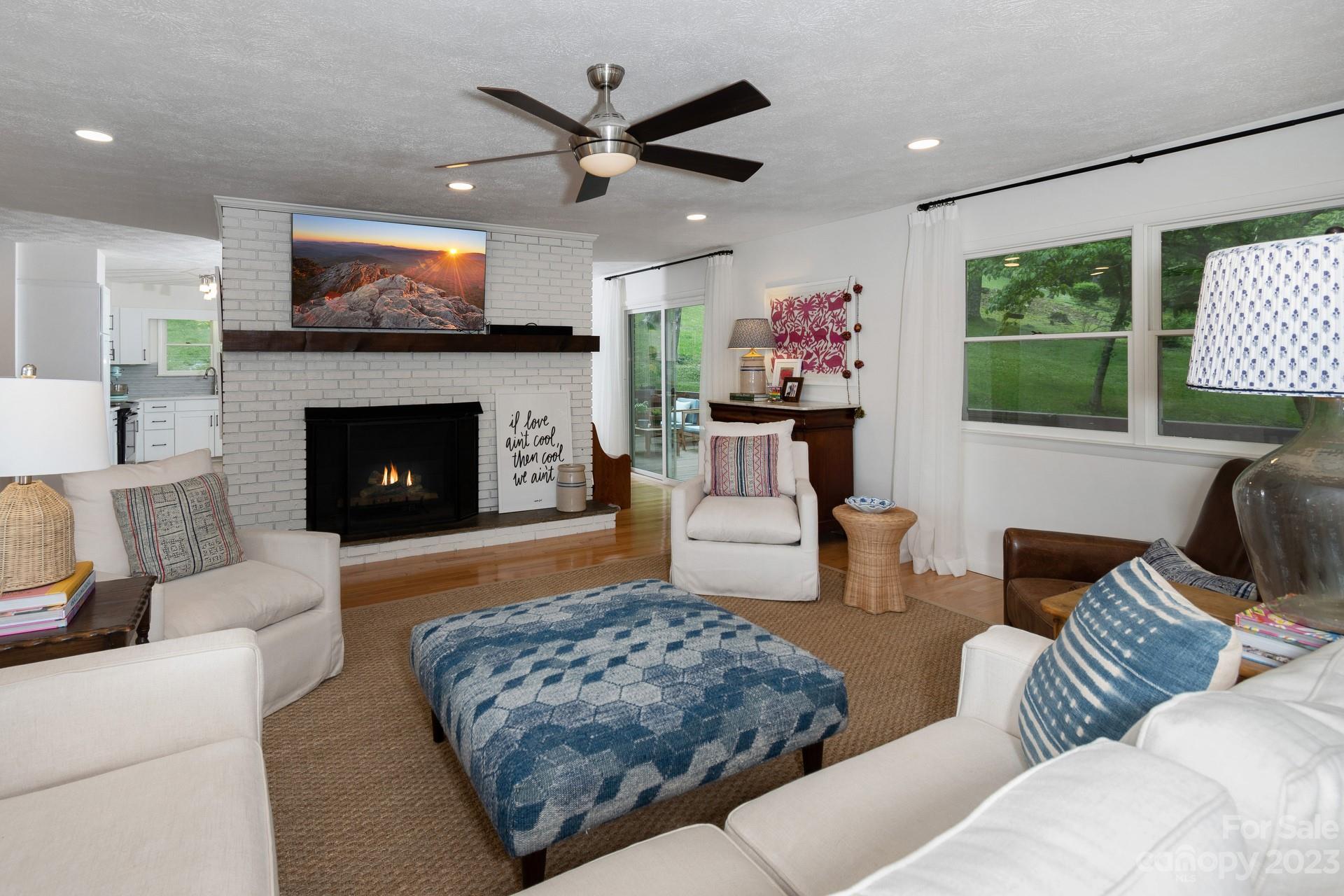 298 Camp Rock Road, Unit 14 Boone, NC 28607 - Photo 24 of 45 a living room with furniture and a fireplace