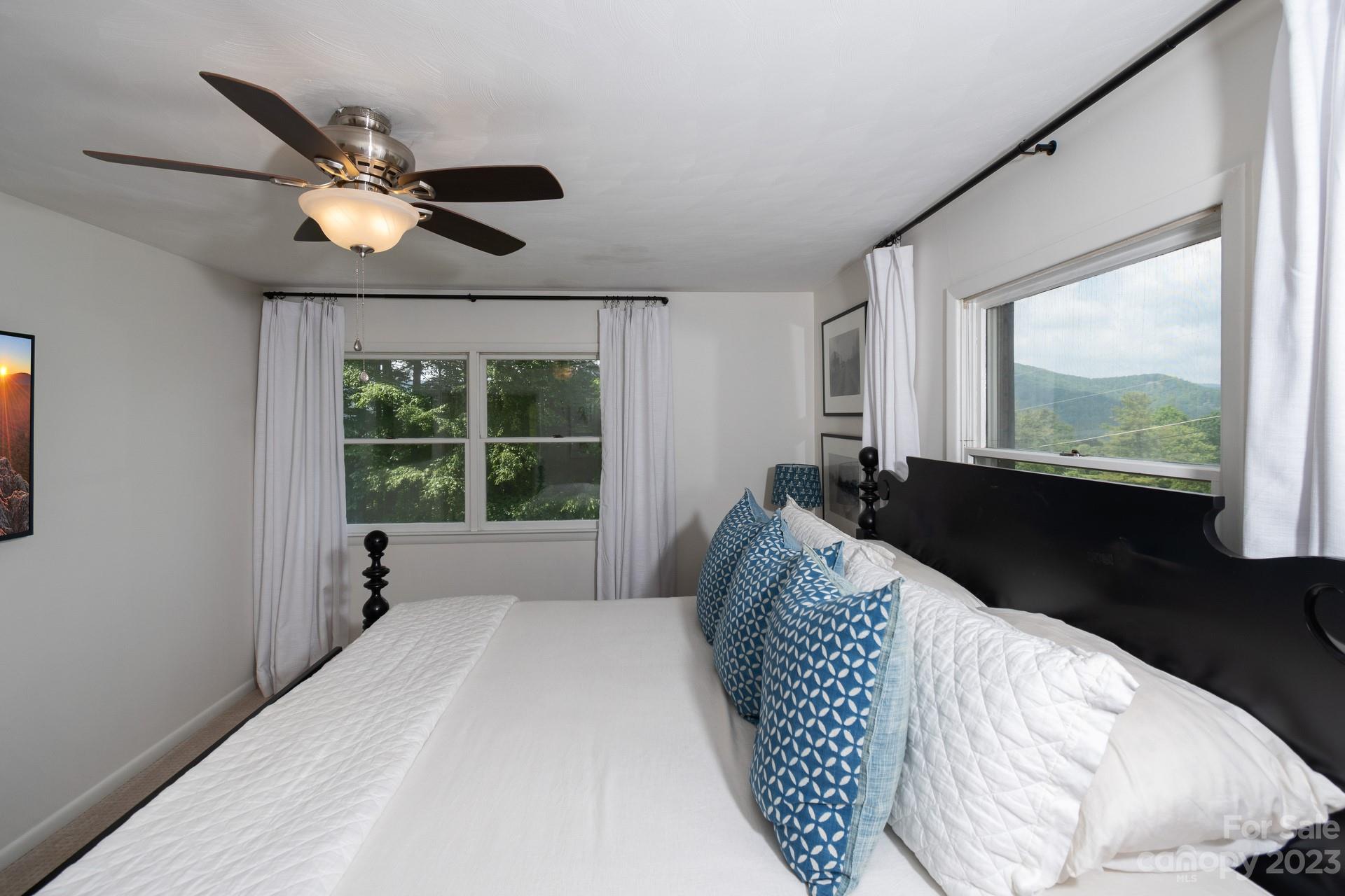 298 Camp Rock Road, Unit 14 Boone, NC 28607 - Photo 31 of 45 a bedroom with a bed and a large window