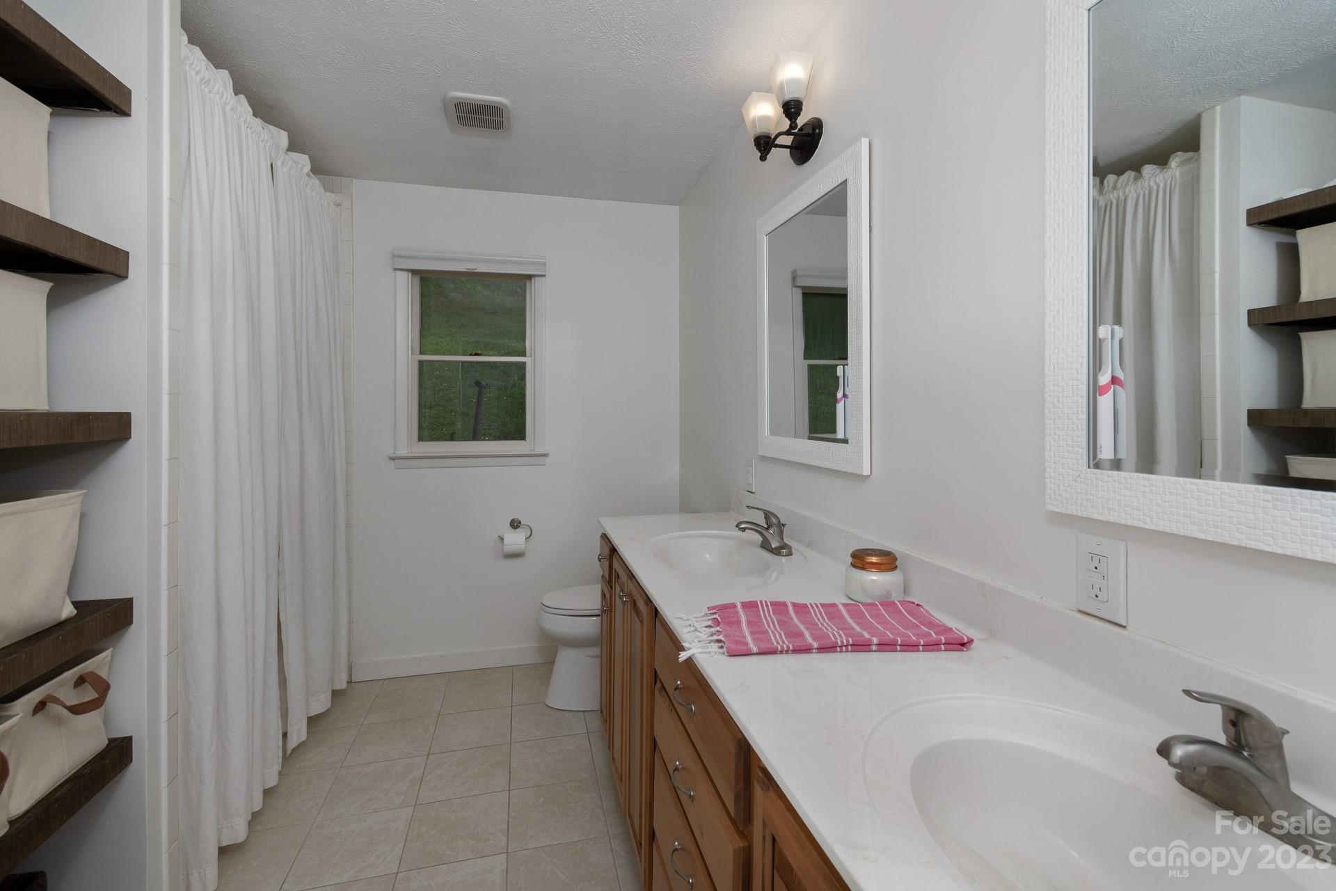 298 Camp Rock Road, Unit 14 Boone, NC 28607 - Photo 34 of 45 a bathroom with a sink and a mirror