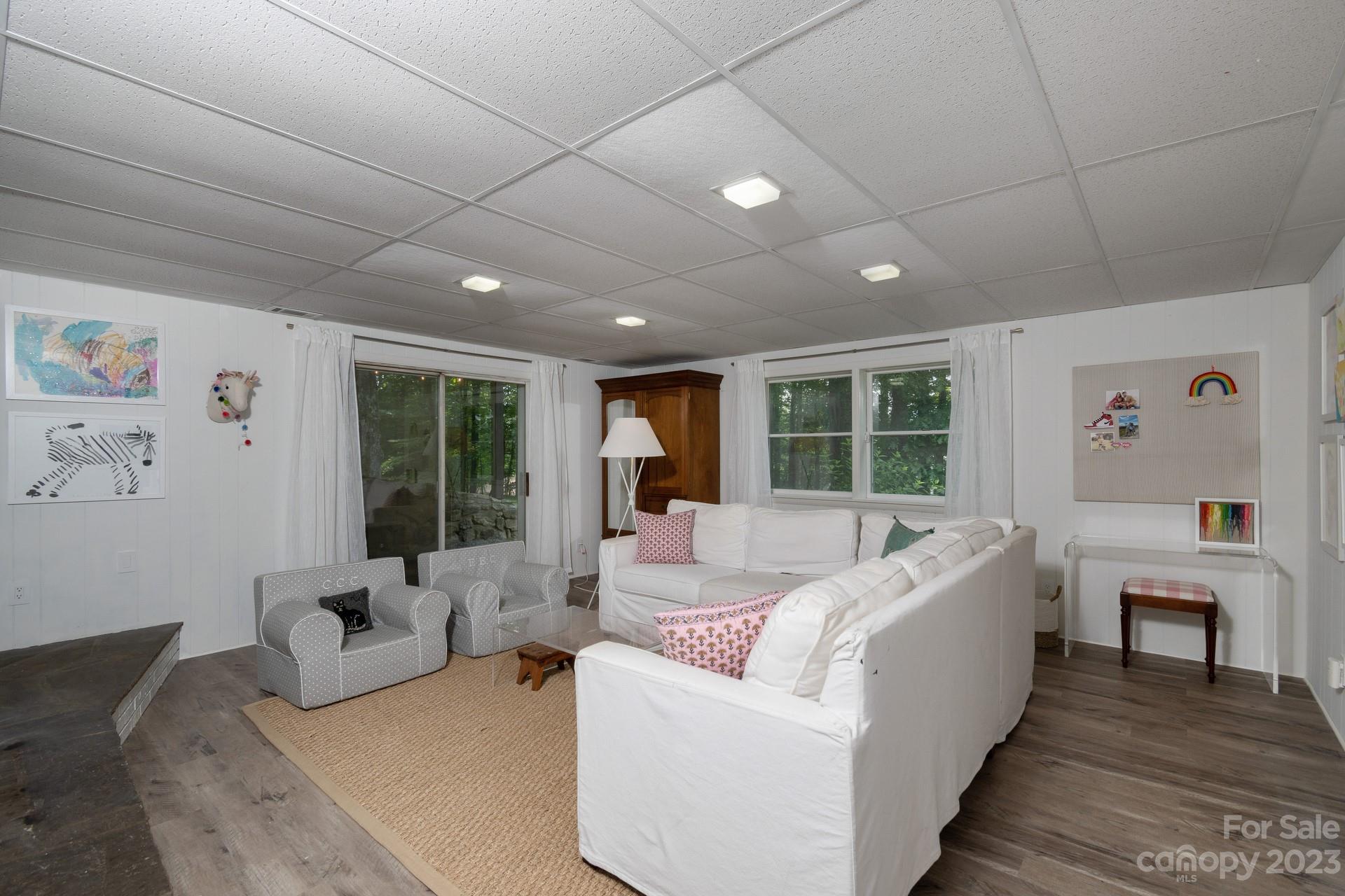 298 Camp Rock Road, Unit 14 Boone, NC 28607 - Photo 35 of 45 a bed room with a bed and a couch