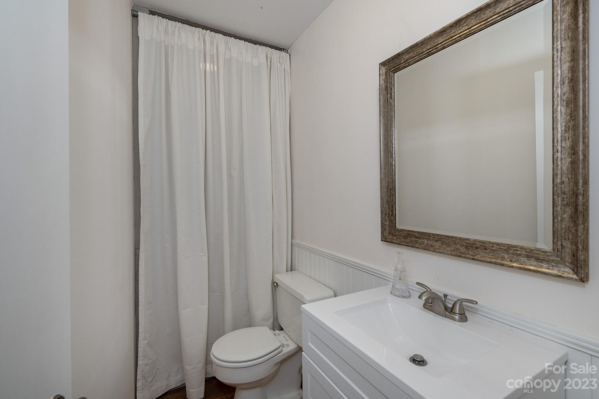298 Camp Rock Road, Unit 14 Boone, NC 28607 - Photo 40 of 45 a bathroom with a sink a toilet and shower