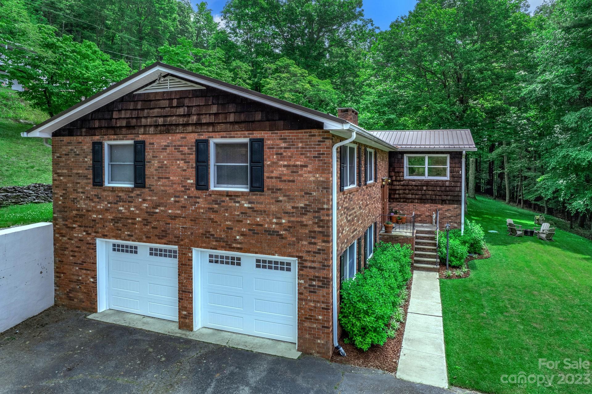 298 Camp Rock Road, Unit 14 Boone, NC 28607 - Photo 42 of 45 a front view of a house with a yard