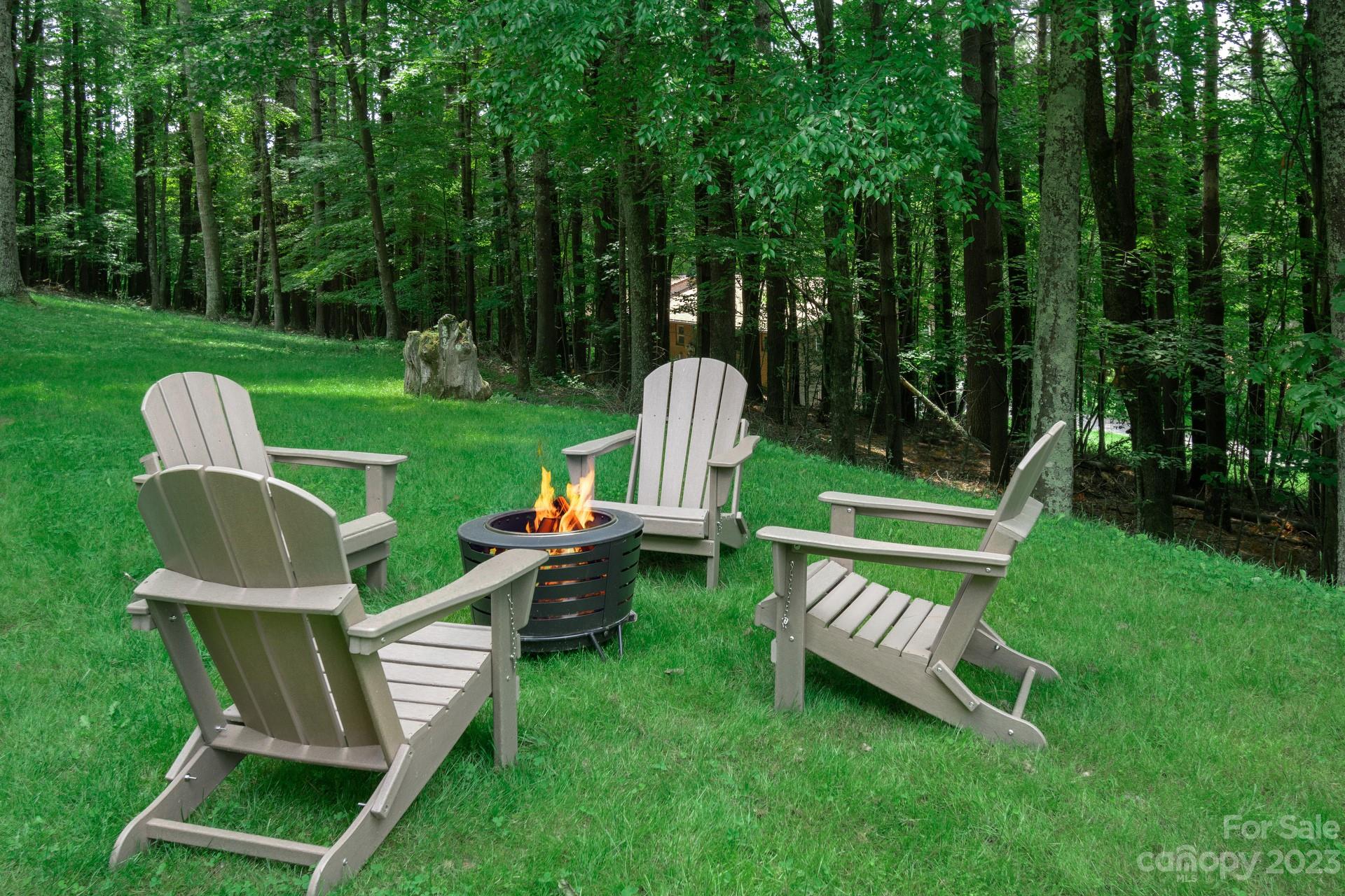 298 Camp Rock Road, Unit 14 Boone, NC 28607 - Photo 43 of 45 a view of a chair and table in the garden