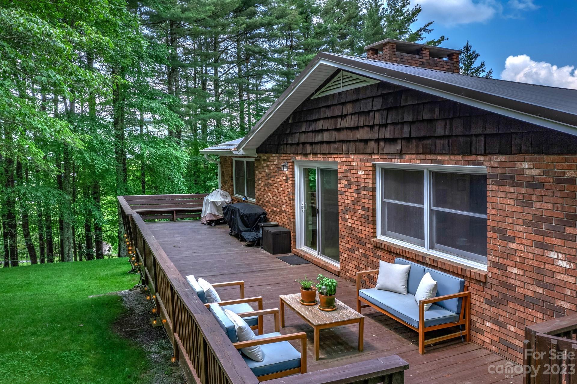 298 Camp Rock Road, Unit 14 Boone, NC 28607 - Photo 6 of 45 a view of house with backyard and sitting area