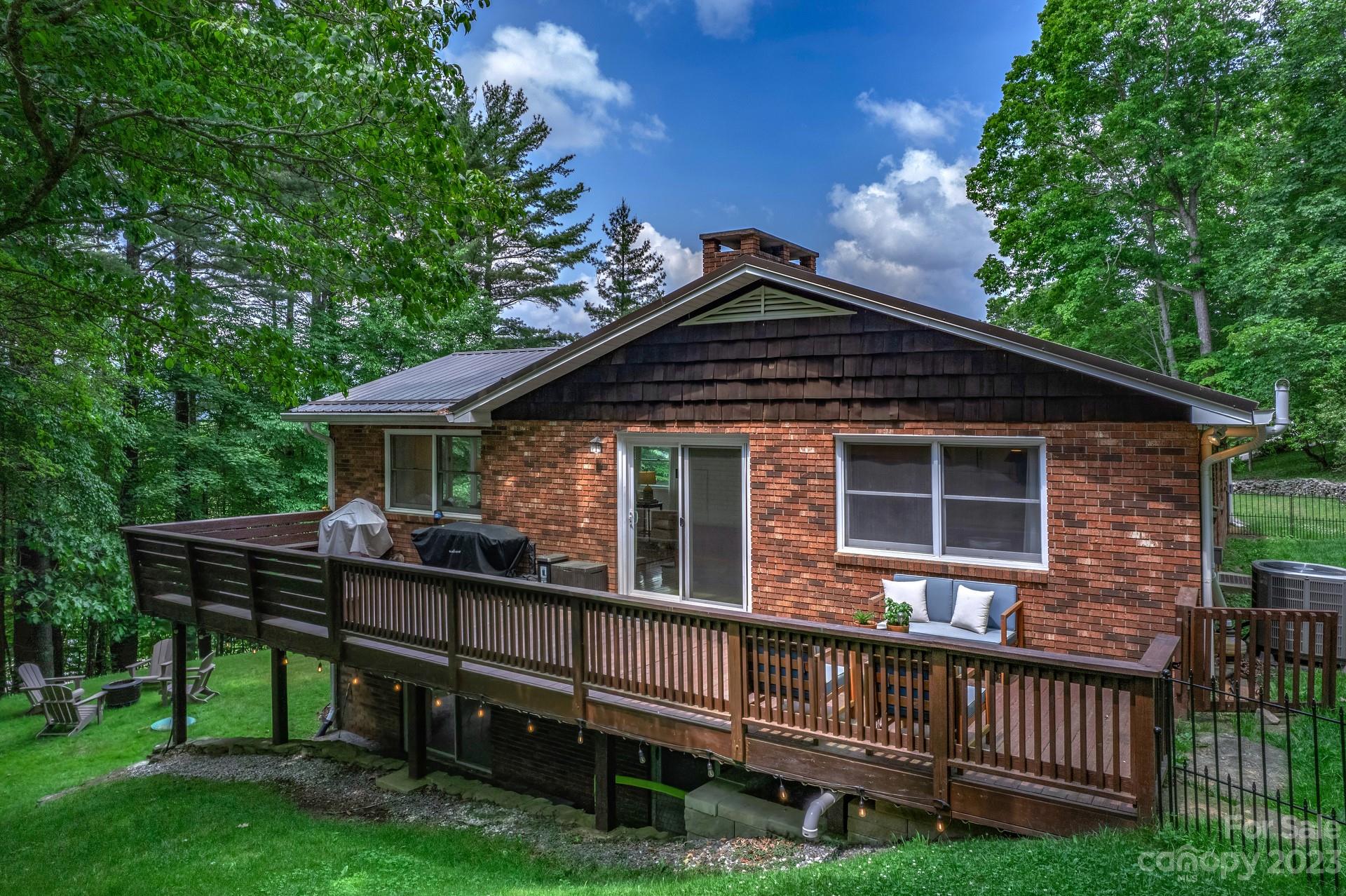 298 Camp Rock Road, Unit 14 Boone, NC 28607 - Photo 7 of 45 a front view of a house with a wooden deck