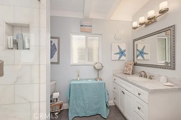 a bathroom with a double vanity sink and mirror