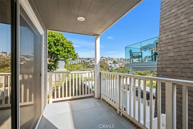 a view of a balcony with wooden floor