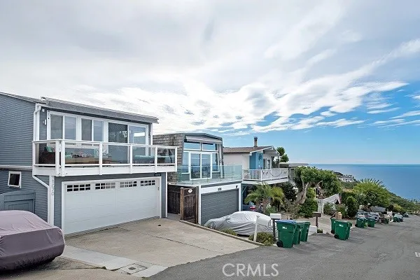 a roof deck with table and chairs