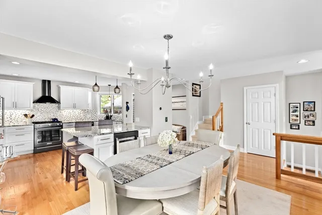 a large kitchen with a table and chairs