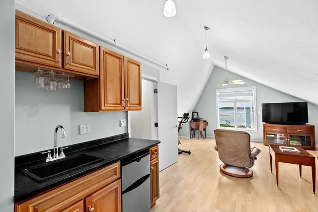 a kitchen with stainless steel appliances granite countertop a stove and a sink