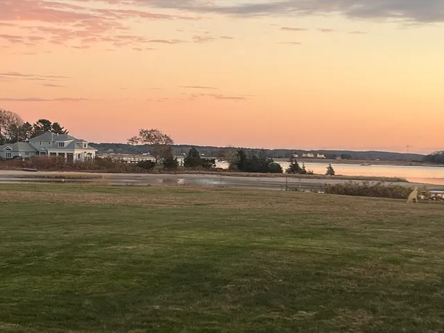 a view of a lake with a big yard