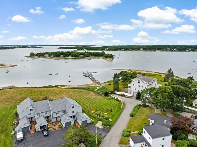 an aerial view of a city with lake view