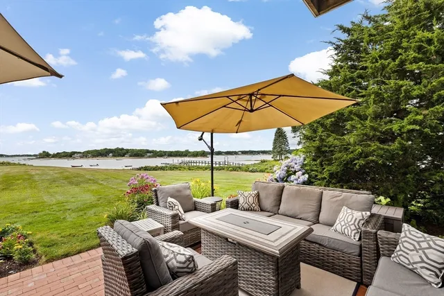 a view of patio with lake view and a patio