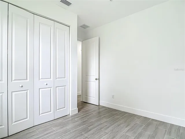 a view of a livingroom with wooden floor
