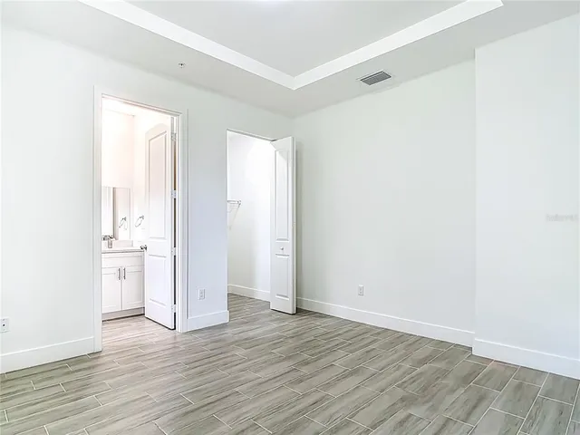 a view of a kitchen with wooden floor