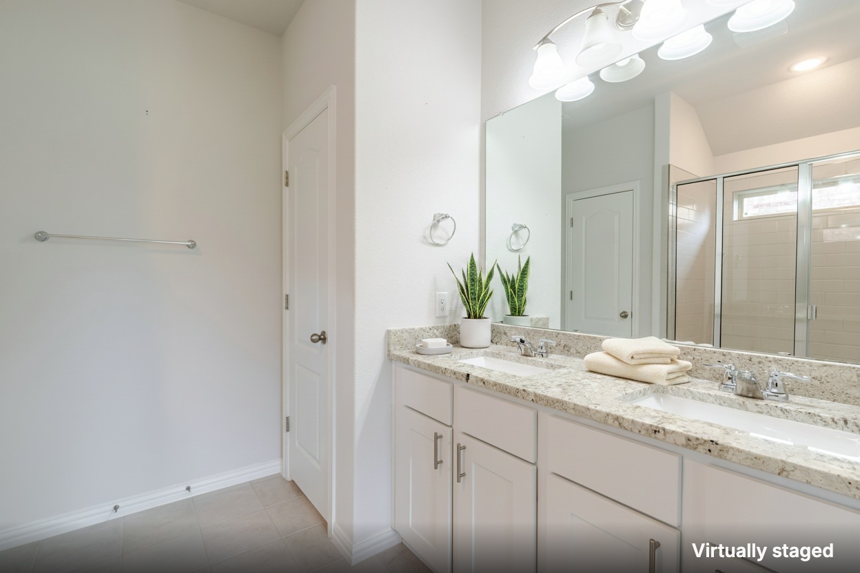 1117 Terrace View Georgetown, TX 78628 - Photo 8 of 25 Dual vanity with elegant granite counters and an inviting shower create a functional bathroom.
