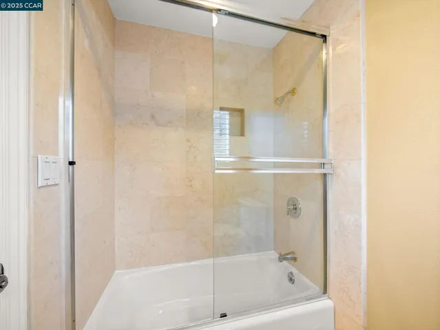 a bathroom with a bath tub