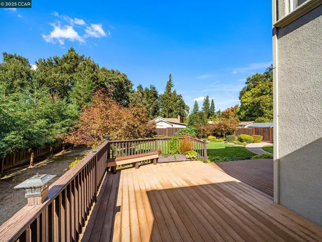 a view of a balcony with wooden floor