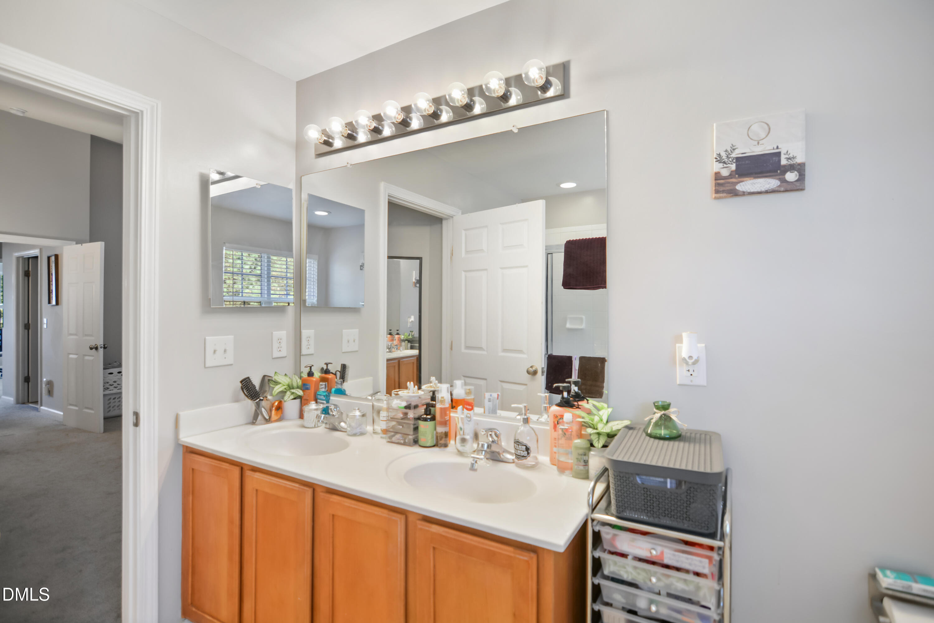 8707 River Keeper Way Raleigh, NC 27616 - Photo 17 of 26 a bathroom with a sink double vanity and a mirror
