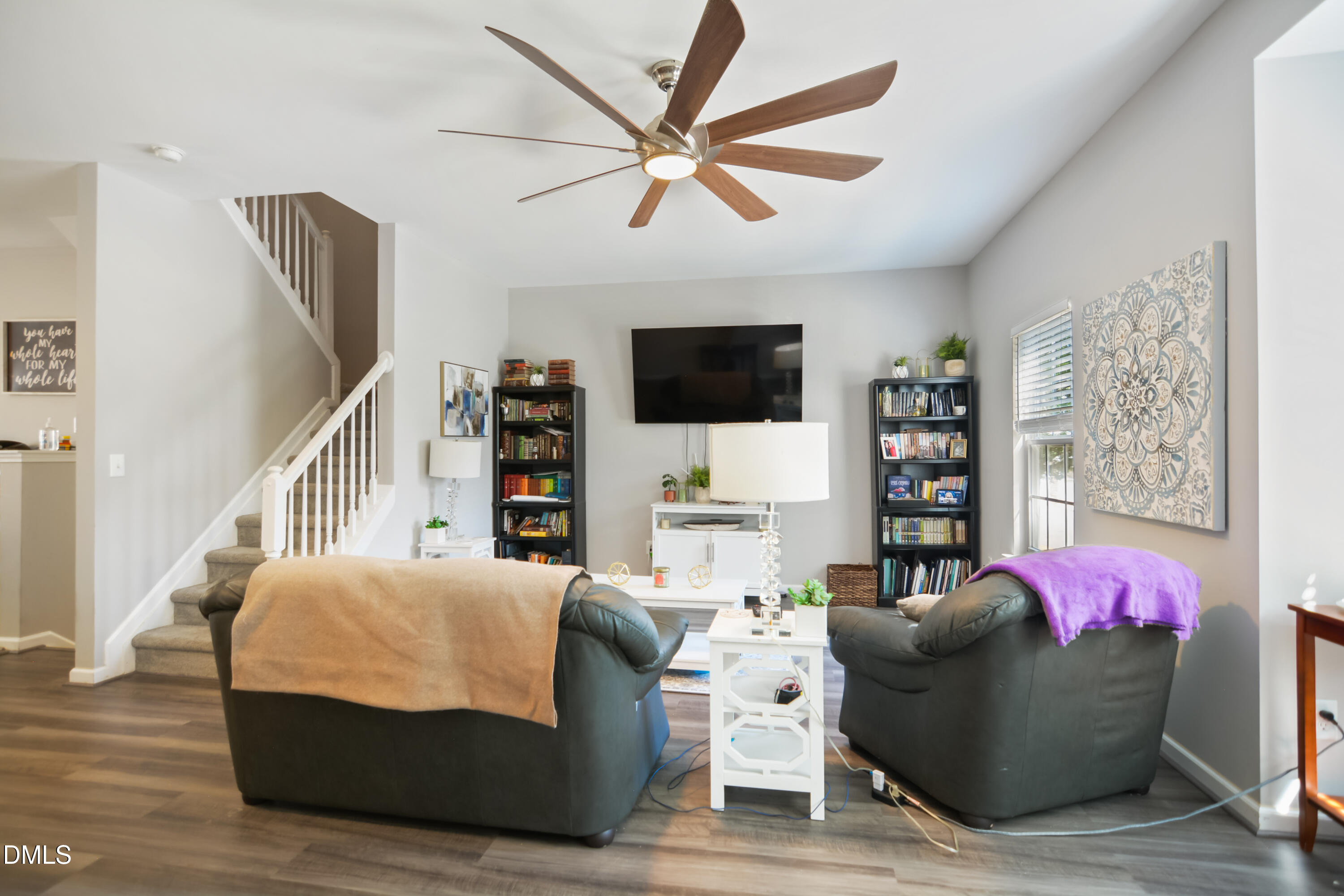 8707 River Keeper Way Raleigh, NC 27616 - Photo 5 of 26 a living room with furniture window and a flat screen tv
