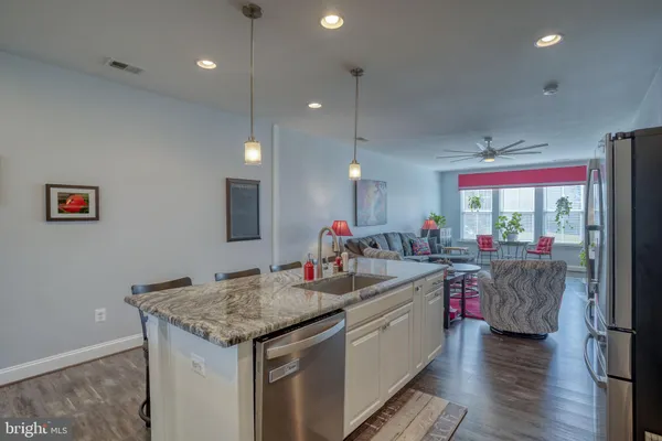 a kitchen with sink and center island