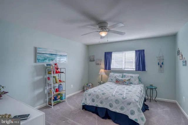 a bedroom with a bed a chandelier and closet