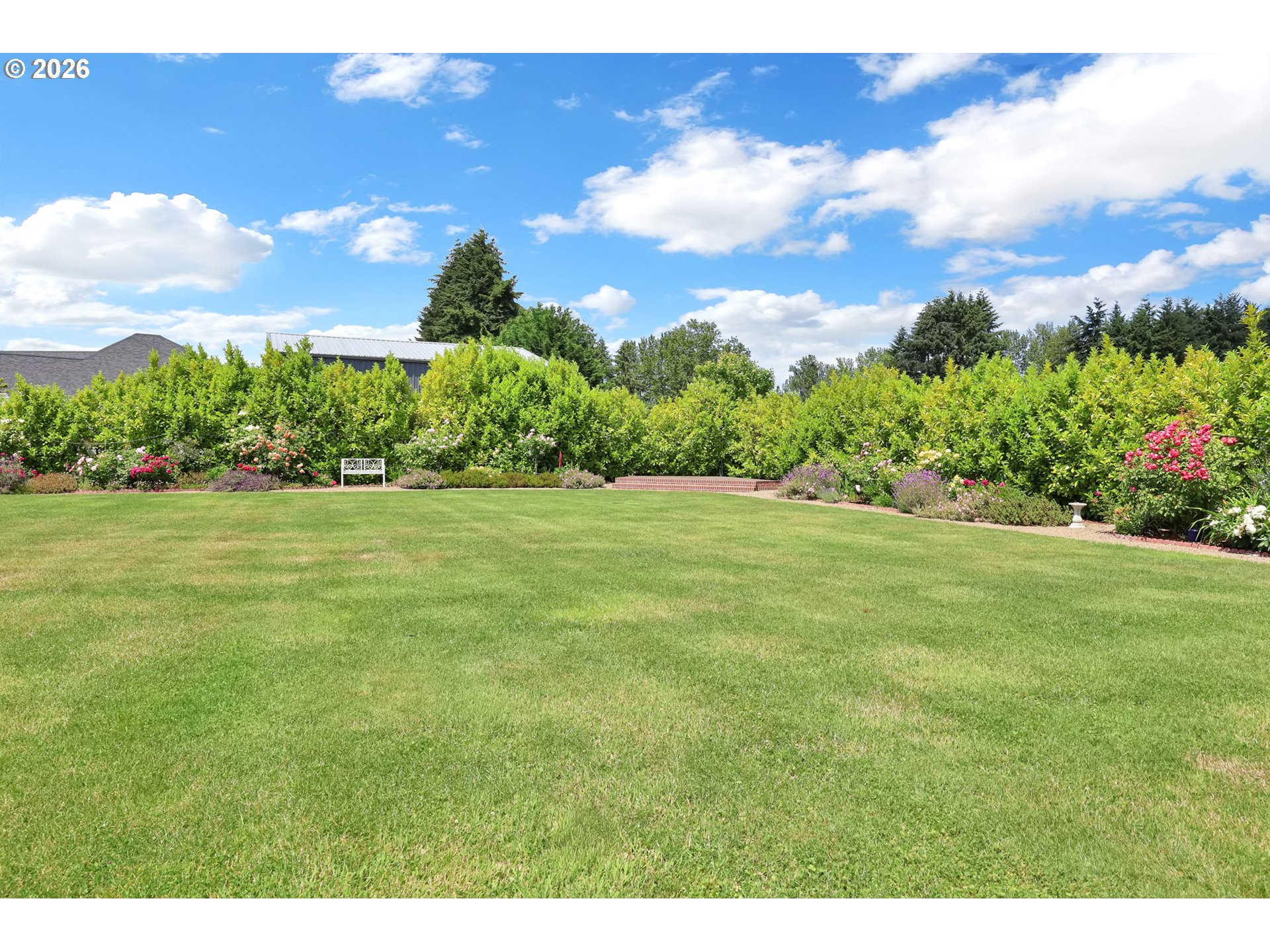 90440 Goodman Road Junction City, OR 97448 - Photo 39 of 48 a view of a garden with a building