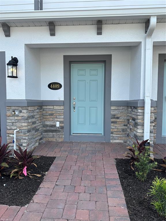 4409 Campsite Loop Orlando, FL 32824 - Photo 2 of 32 a view of a entryway door front of house