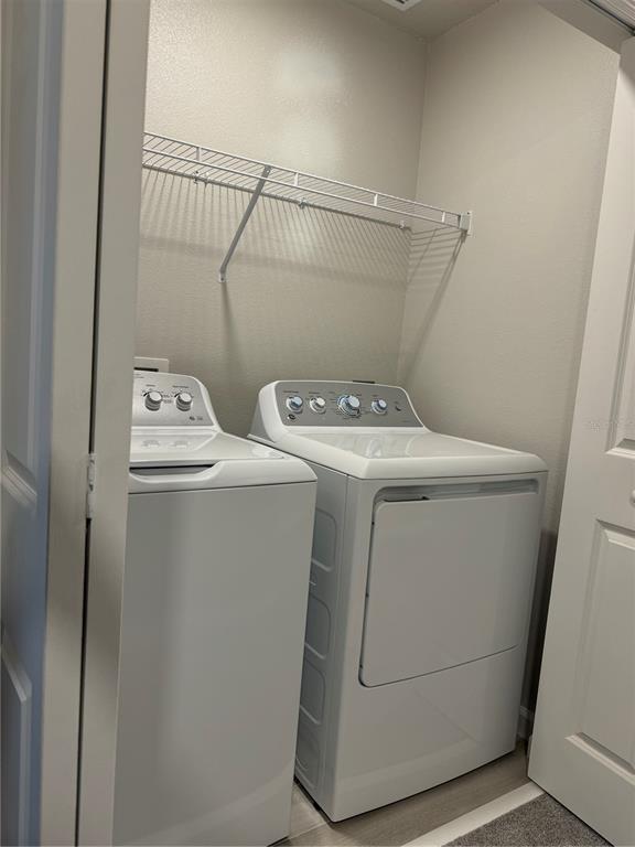 4409 Campsite Loop Orlando, FL 32824 - Photo 21 of 32 a utility room with dryer and washer