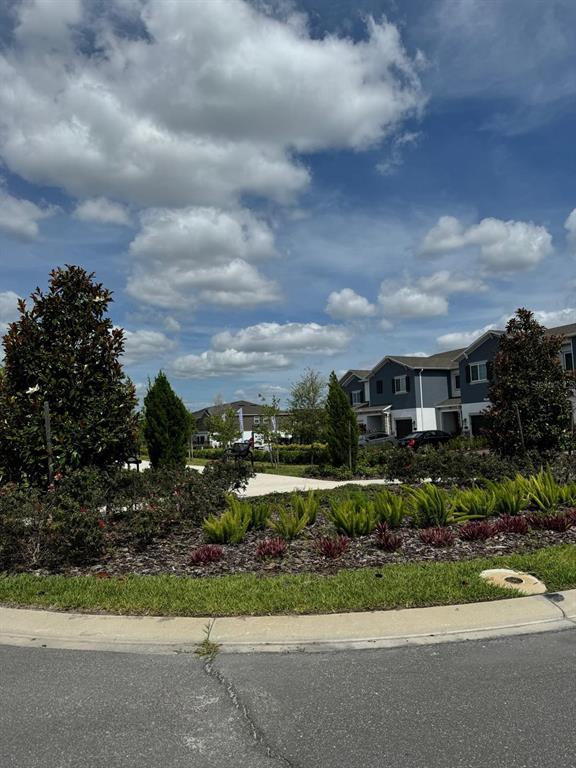 4409 Campsite Loop Orlando, FL 32824 - Photo 25 of 32 a view of a garden with a pathway