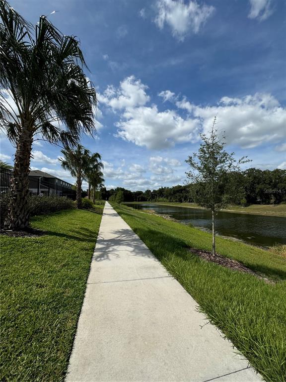 4409 Campsite Loop Orlando, FL 32824 - Photo 28 of 32 a view of a park with flower plants and trees