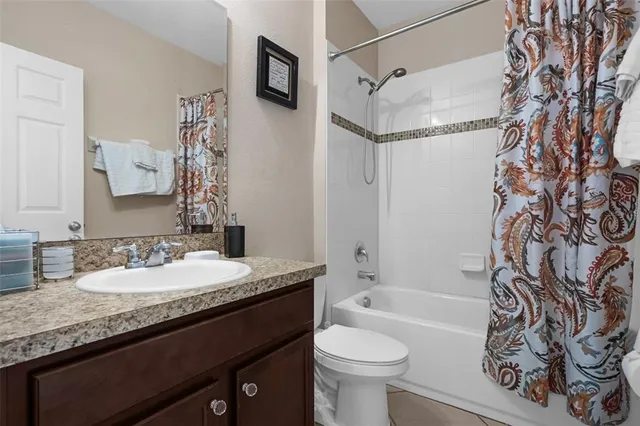 a bedroom with two beds and a table