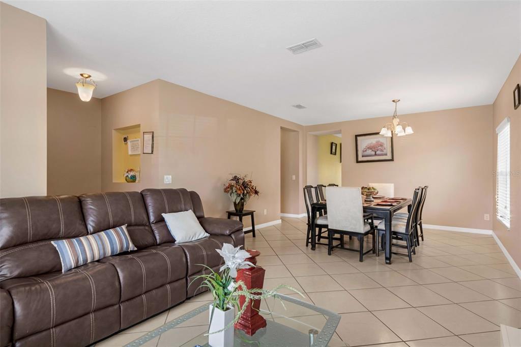 540 Vitoria Road Davenport, FL 33837 - Photo 6 of 21 a living room with furniture and wooden floor