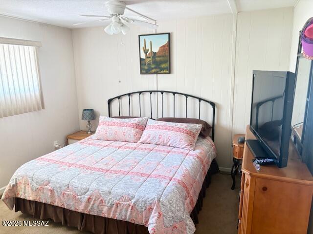 5731 West Flying M Street Tucson, AZ 85713 - Photo 14 of 20 a large bed sitting in a bedroom next to a window