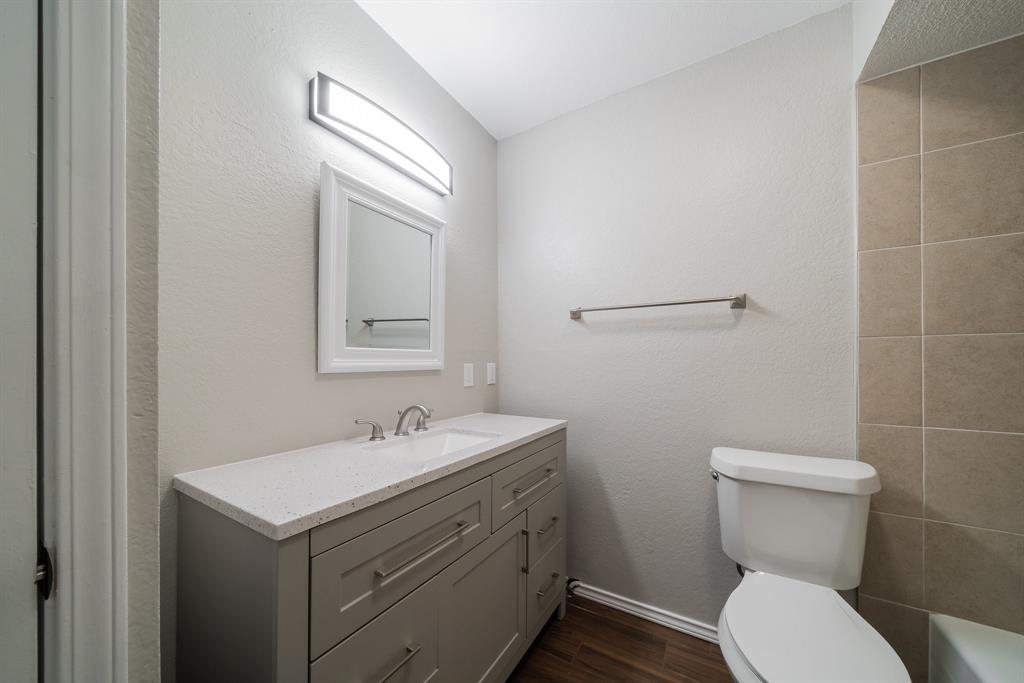 3604 Biscay Drive Arlington, TX 76016 - Photo 17 of 18 a bathroom with a toilet sink and mirror